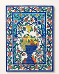 Decorative tiled panel with a blue fruit bowl and floral border, supplied image.