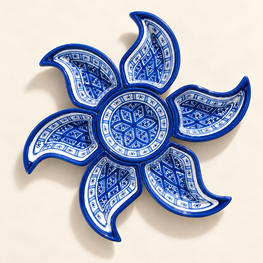 Blue and White Sun-Shaped Appetiser Serving Dish — studio view. AI-generated product visualisation.